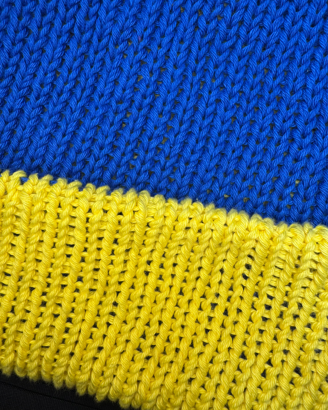 Close-up of blue and yellow knitted fabric