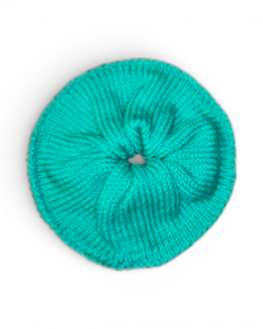Green knit scrunchy on a white background