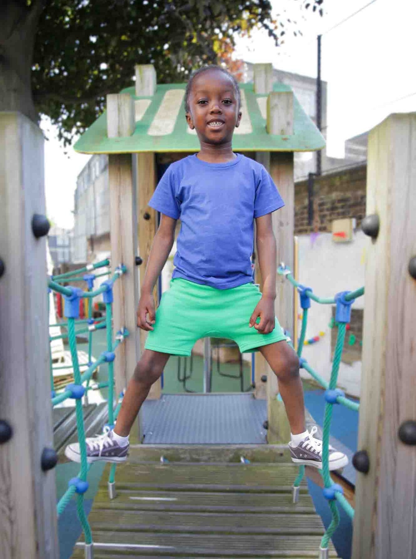Boy wearing blue organic cotton kids T-shirt - sustainable kidswear UK