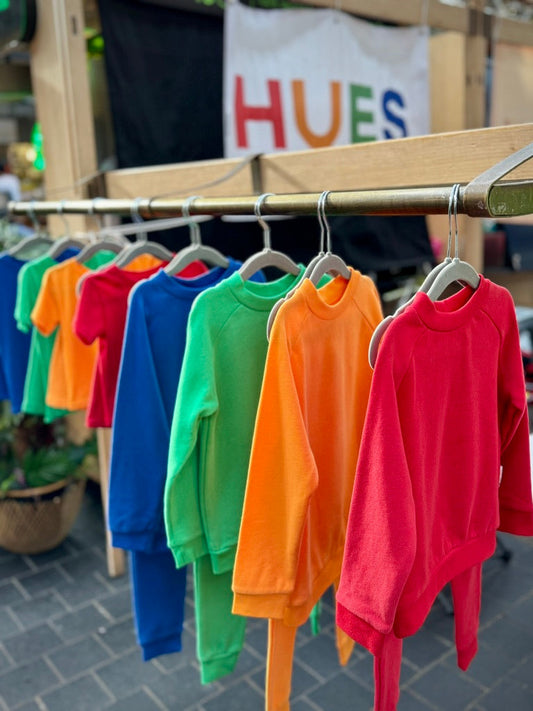 Hues Clothing for kids aged 1-6 hanging on a rail