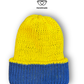 Reversible cotton beanie flipped to show the second colour, handmade in the UK