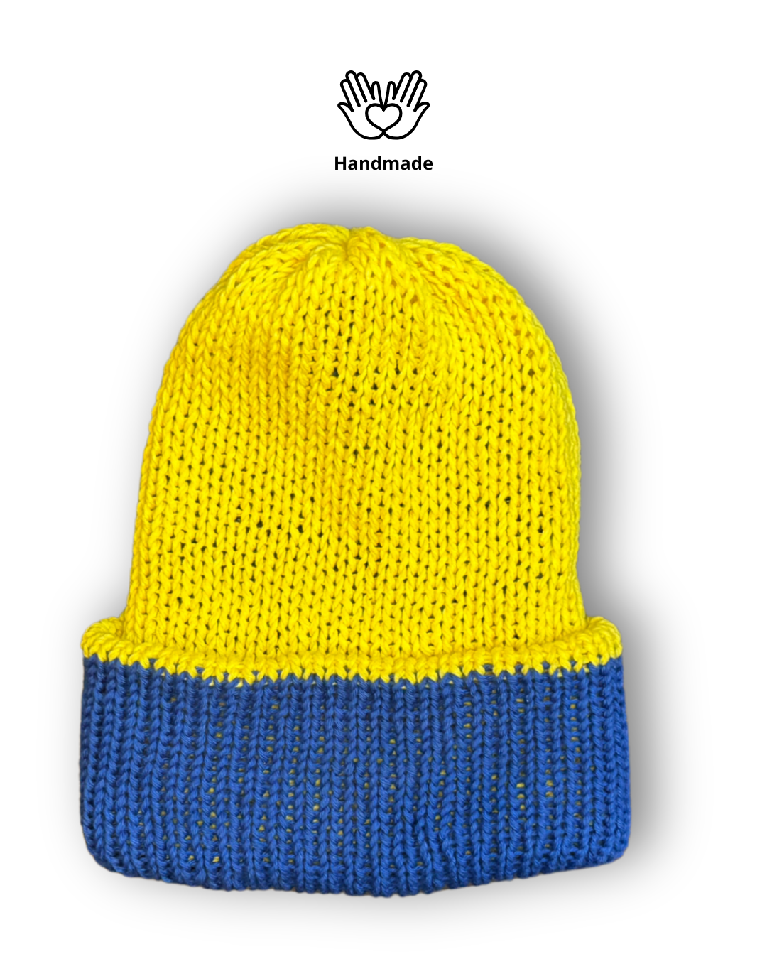 Reversible cotton beanie flipped to show the second colour, handmade in the UK