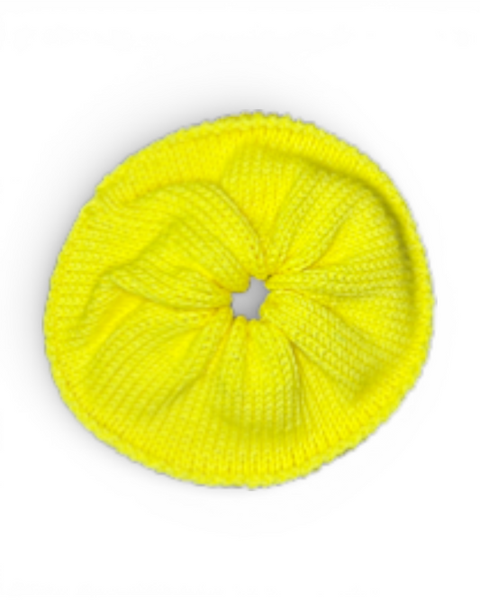 Yellow knitted scrunchy on a white background