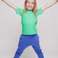 A girl wearing a green t-shirt and blue joggers - Hues Clothing