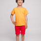 A boy with an orange shirt and red shorts - Hues Clothing