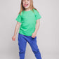 A blonde haired girl wearing a green t-shirt and blue trousers - Hues Clothing